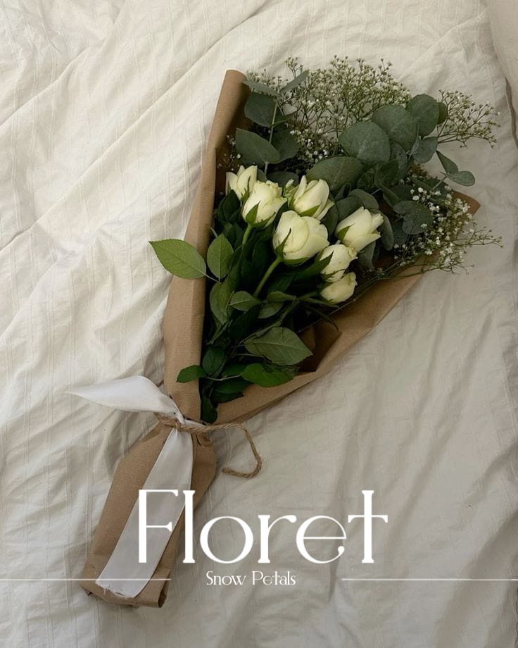 Snow Petals bouquet — Quiet white roses, dressed in kraft and eucalyptus